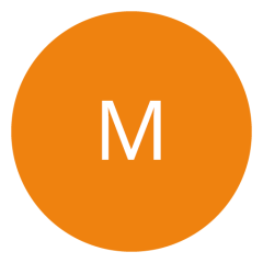 Ein orangefarbener Kreis mit einem weißen Buchstaben „M“ in der Mitte.
